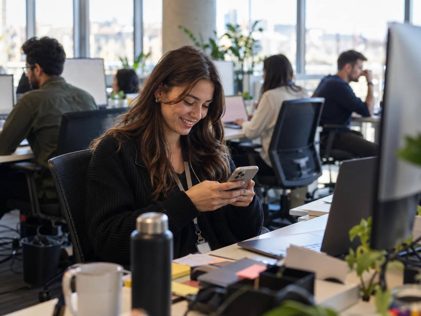 Professional checking a verification code on her smartphone
